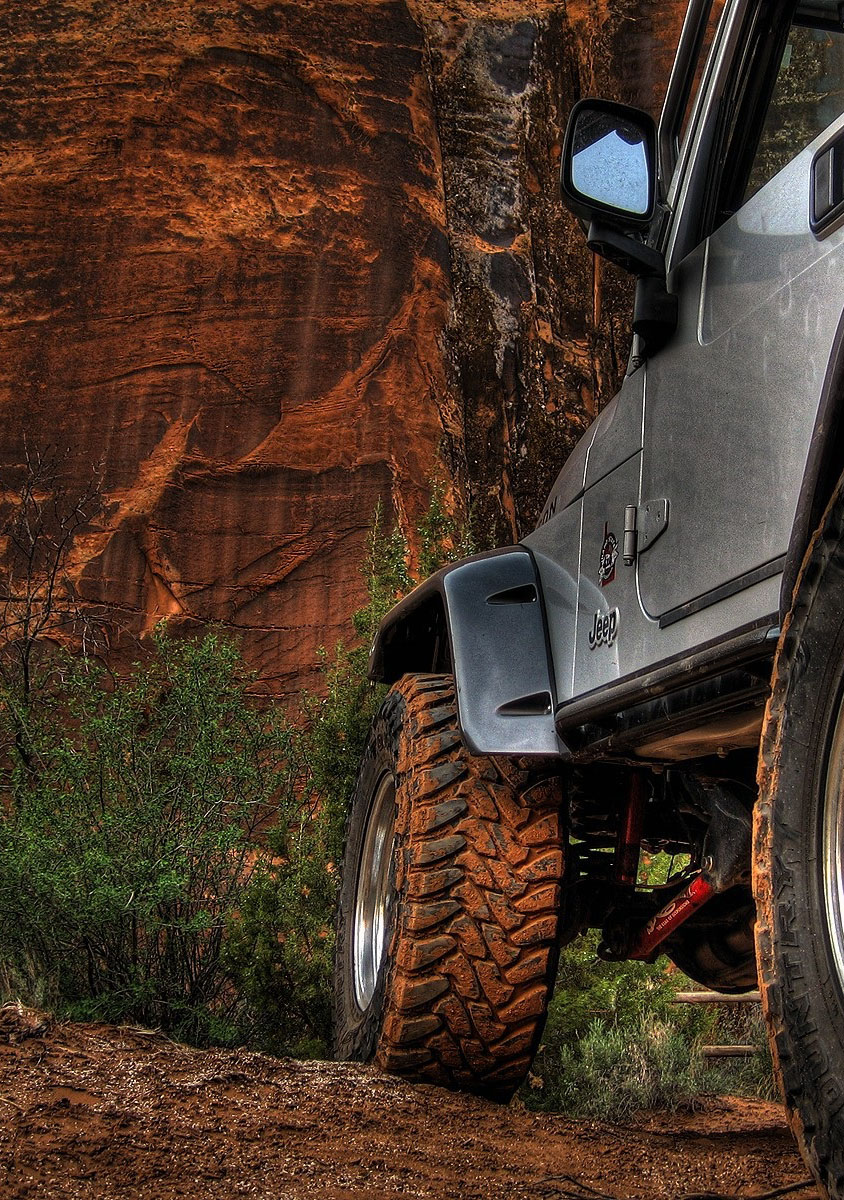 Jeep off-road vehicle navigating rocky terrain