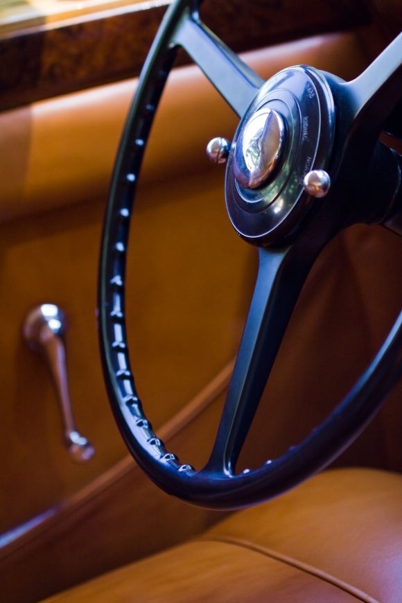 Close-up of steering wheel and interior of a classic car