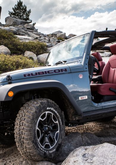 Jeep Rubicon climbing over rocky terrain